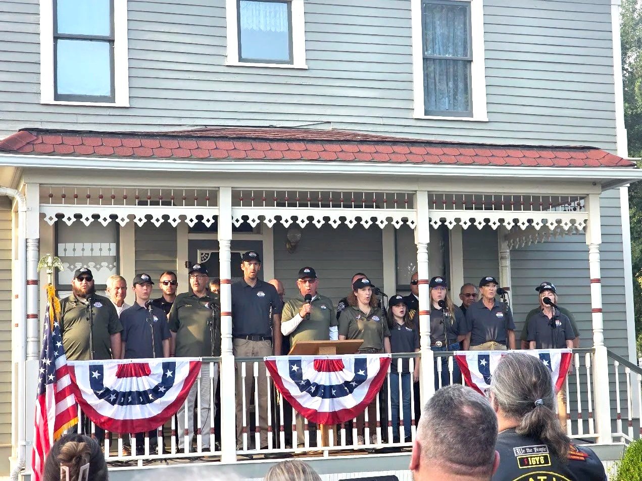 VOC members gathered on the Quincy Valley Museum porch for Patriot Day