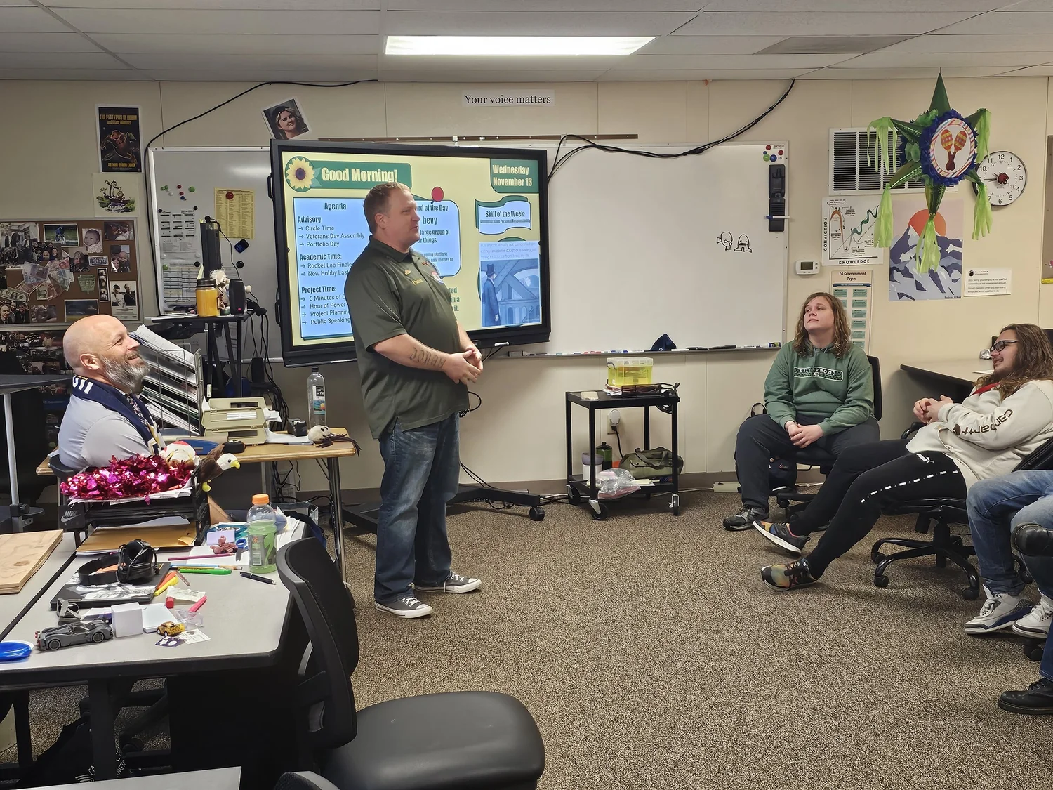 A VOC veteran presenting to students in a classroom